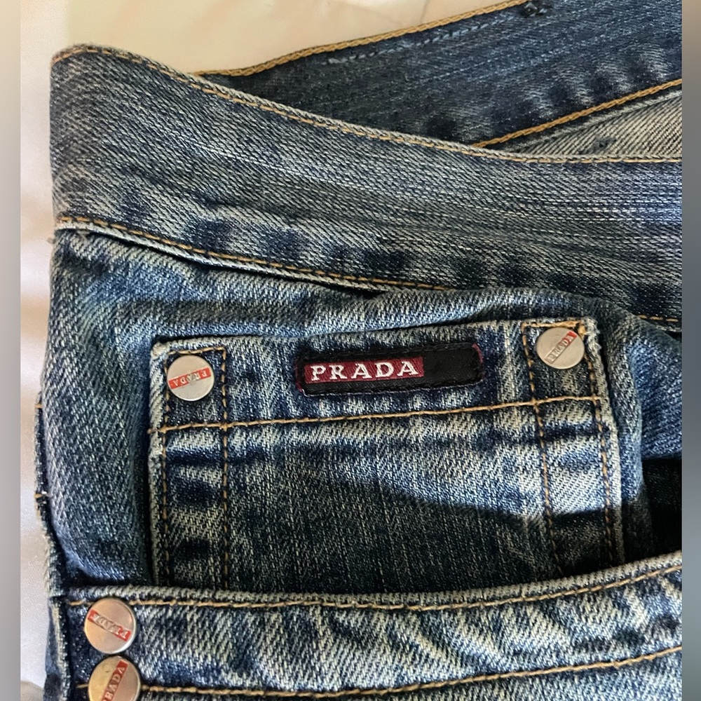 Make a fashion statement with jeans no one has- Prada makes the perfect cut boot